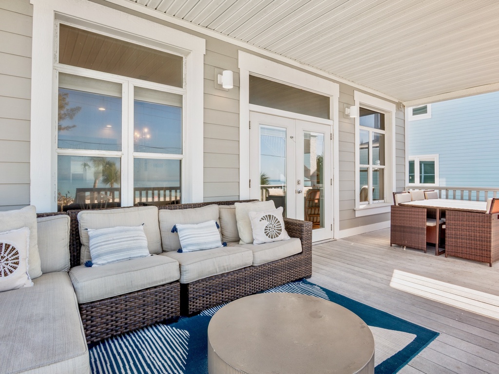 Private covered porch with plush seating
