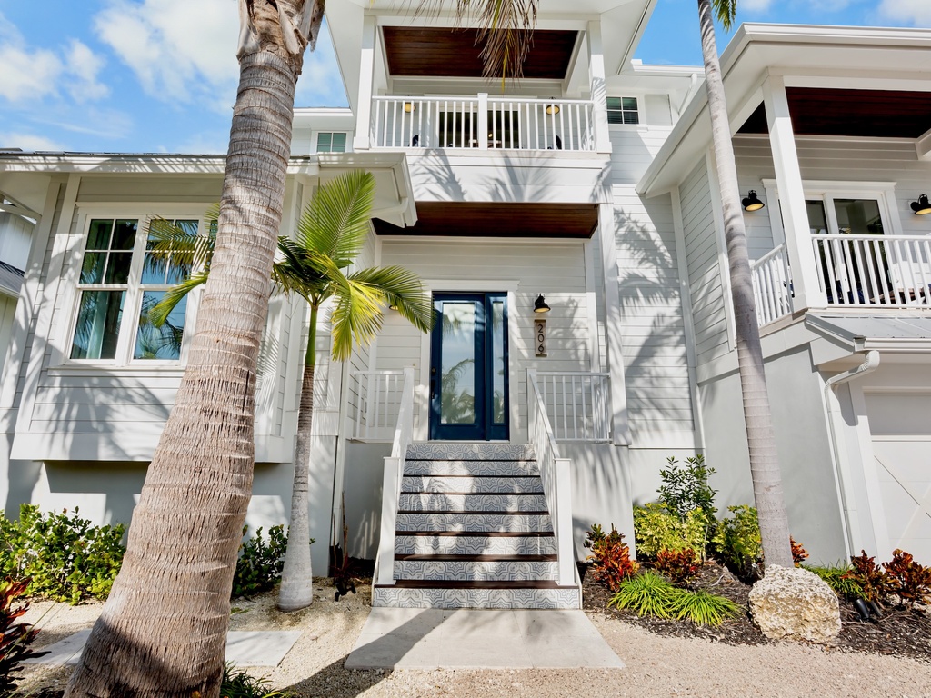 Home exterior with tropical landscaping
