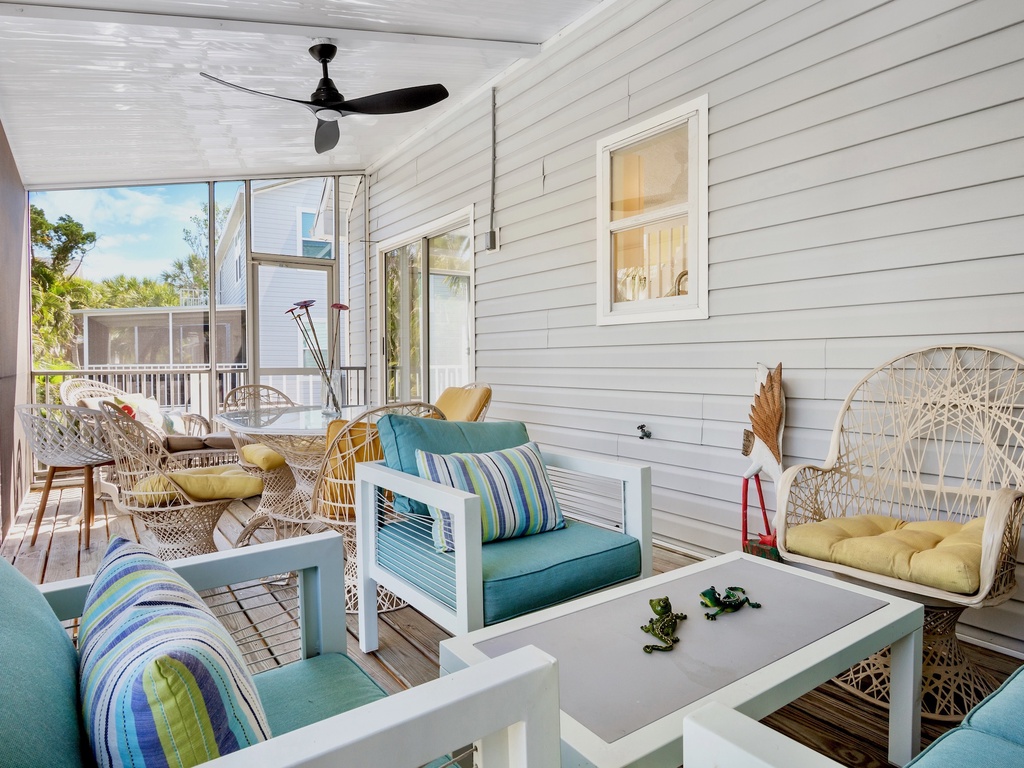 Screened lanai with outdoor dining and lounge seating