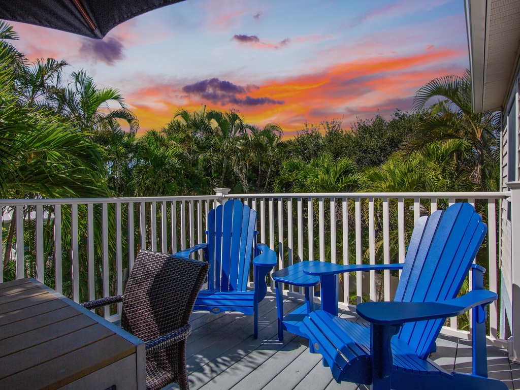Balcony dining area with ocean breeze
