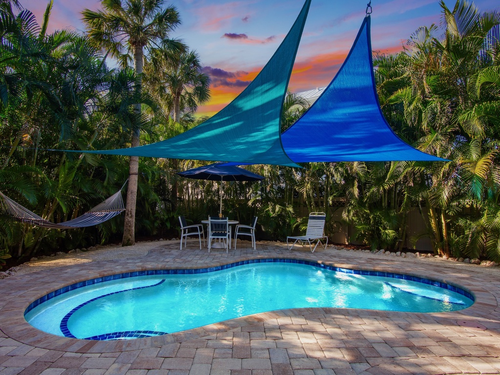 Private pool with shade sails, perfect outdoor retreat