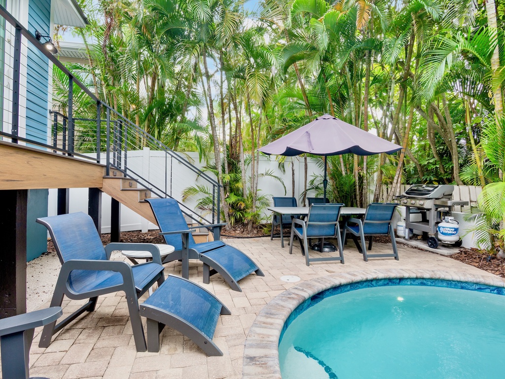 Poolside Loungers and Dining Area