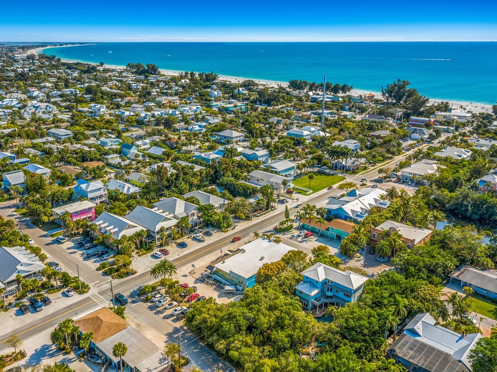 Stunning coastal community with beach access and tropical landscaping in a prime waterfront location.
