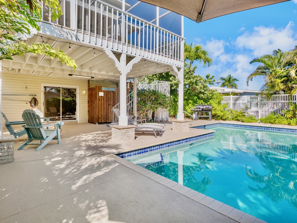 Private poolside oasis with comfortable seating
