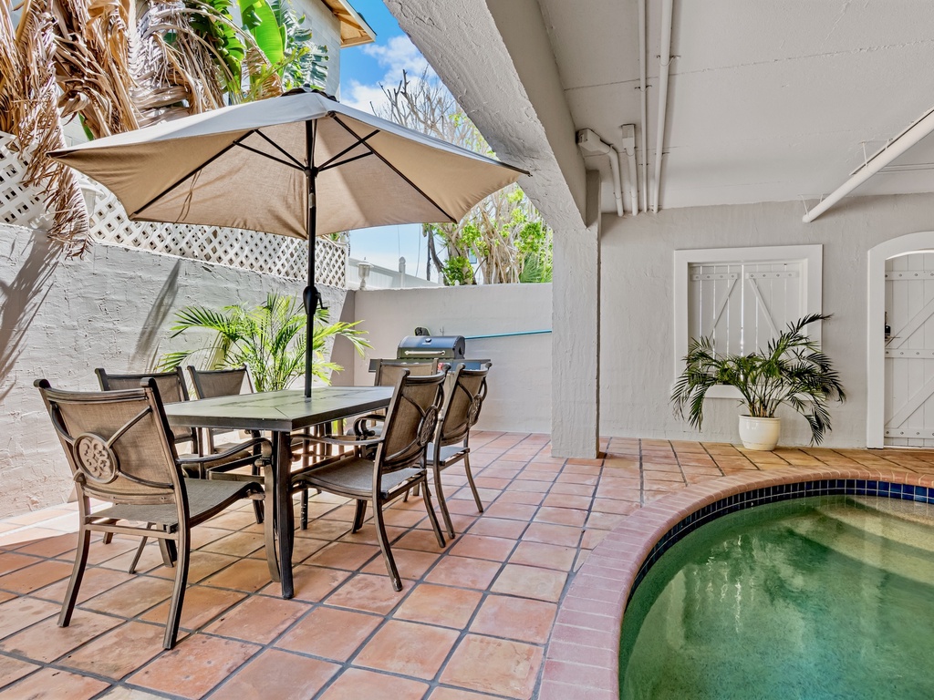 Covered Outdoor Patio with Pool and Grill