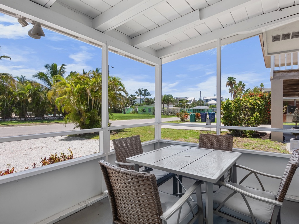 Relax and enjoy outdoor dining in the screened patio.