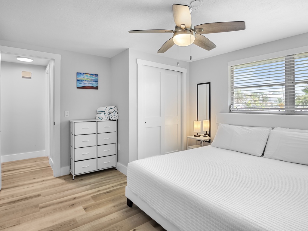 Primary bedroom with king bed and plenty of natural light.