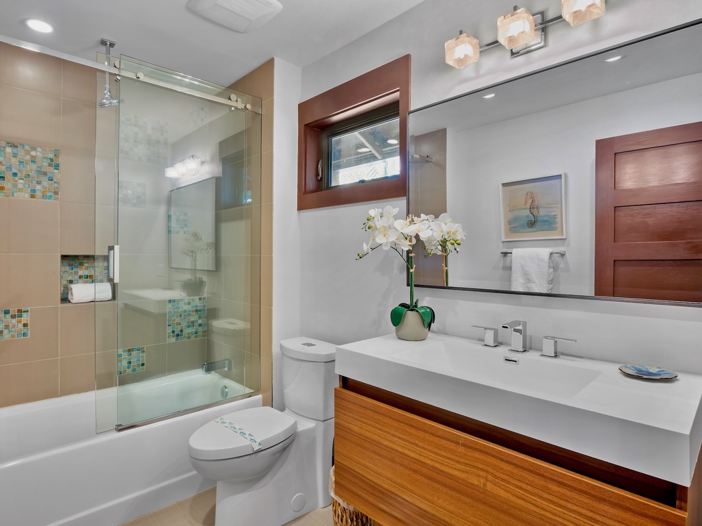 Second bathroom with tub and shower combo