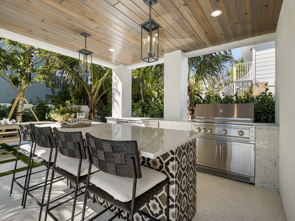 Private outdoor kitchen with bar seating