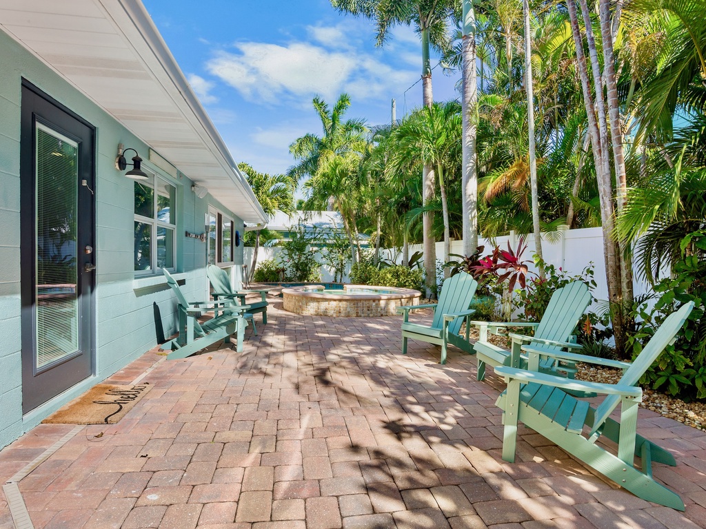 Private patio with adirondack chairs