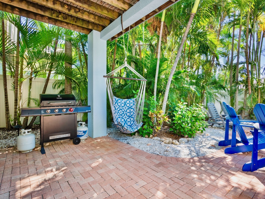 Outdoor BBQ grill and relaxing swing chair