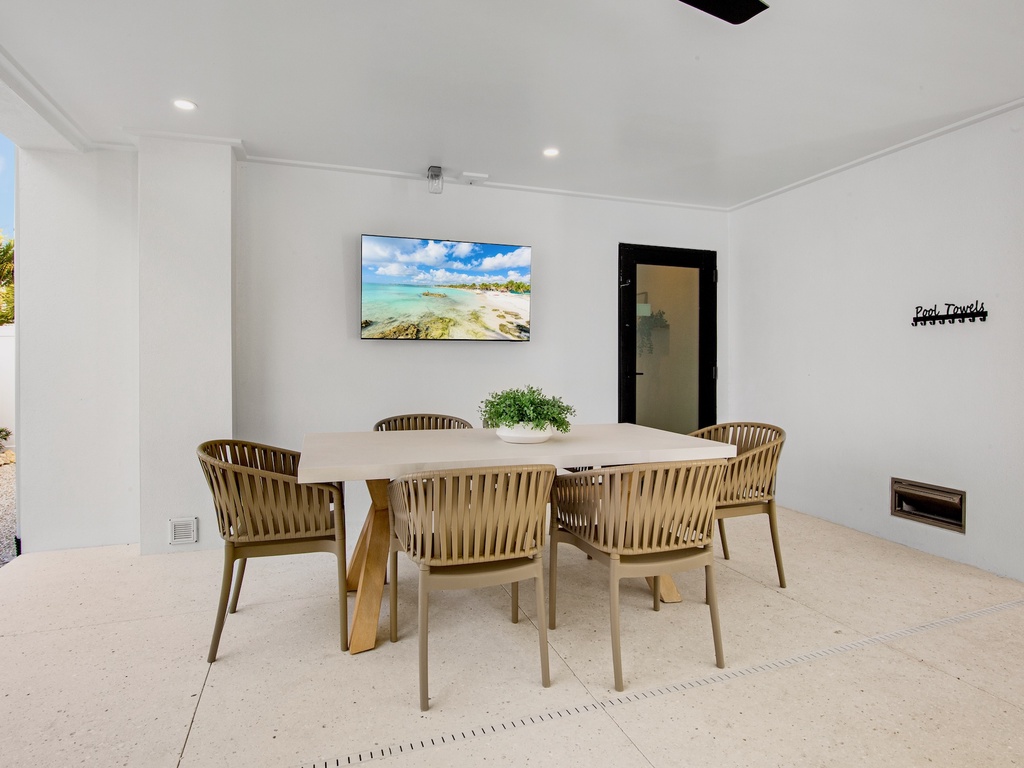 Outdoor dining table with TV.