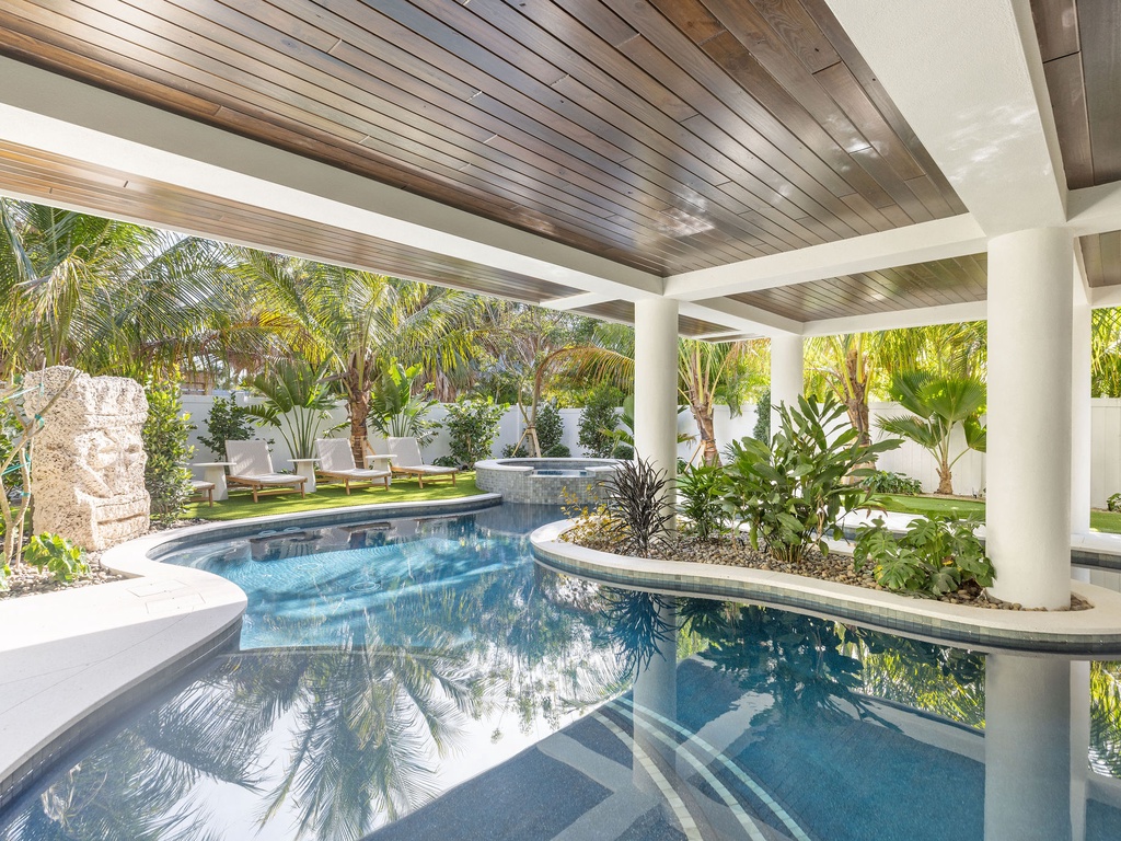 Private pool oasis surrounded by lush tropical palms