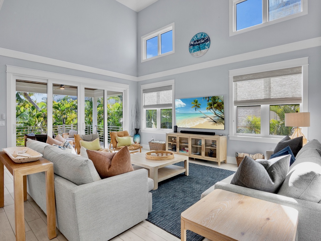 Living area with TV and sliding doors to your private oasis