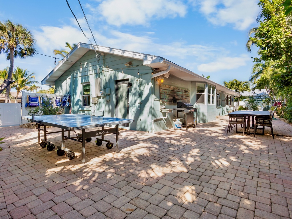 Outdoor dining, ping pong, and BBQ area