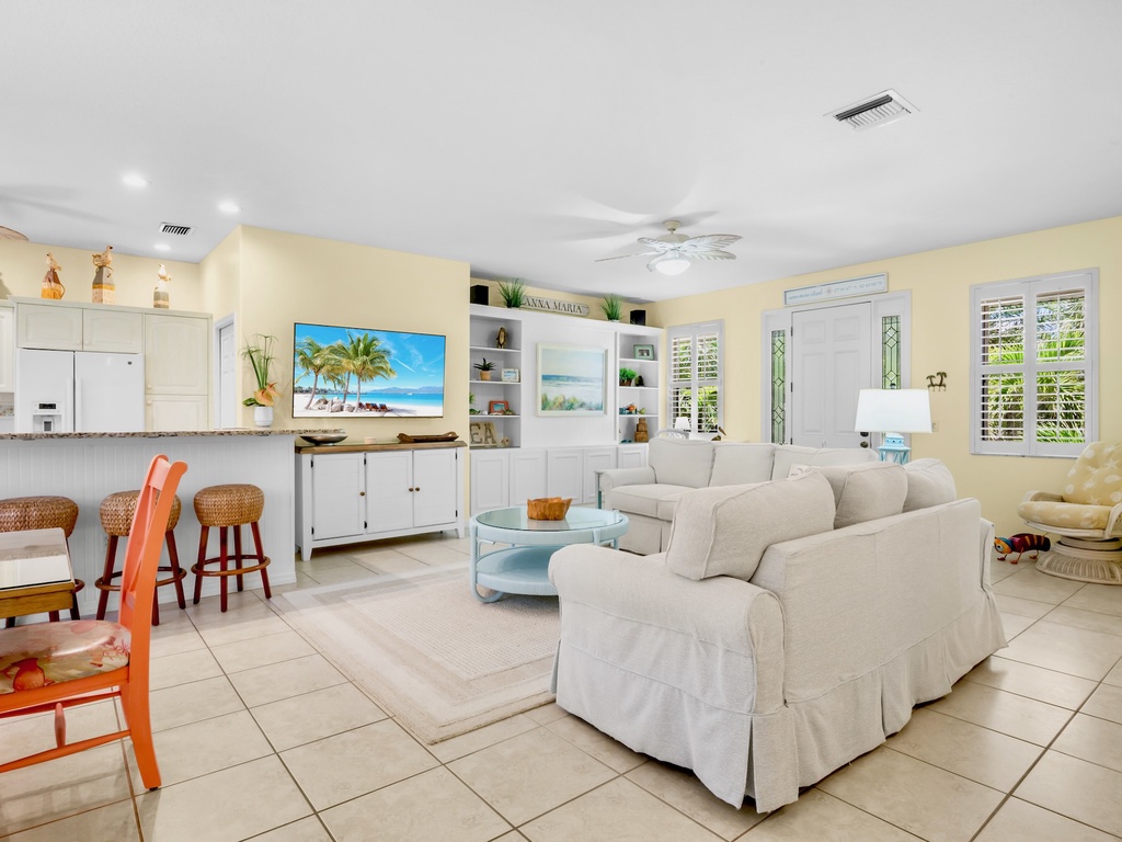 Living area with plush seating and TV