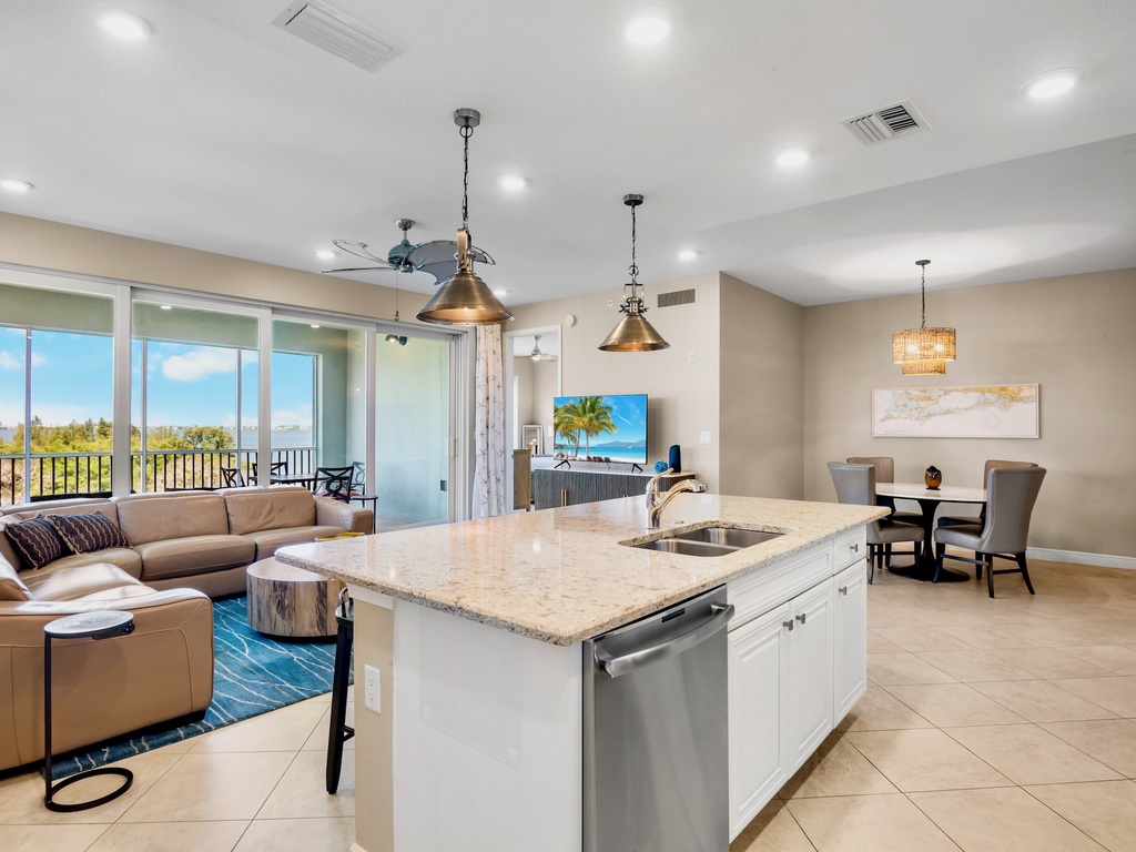 Open living and dining area with private screened lanai access