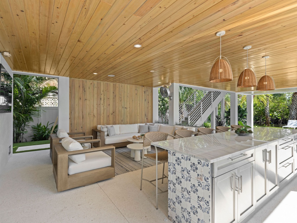 Outdoor Lounge with Kitchen and Island Seating