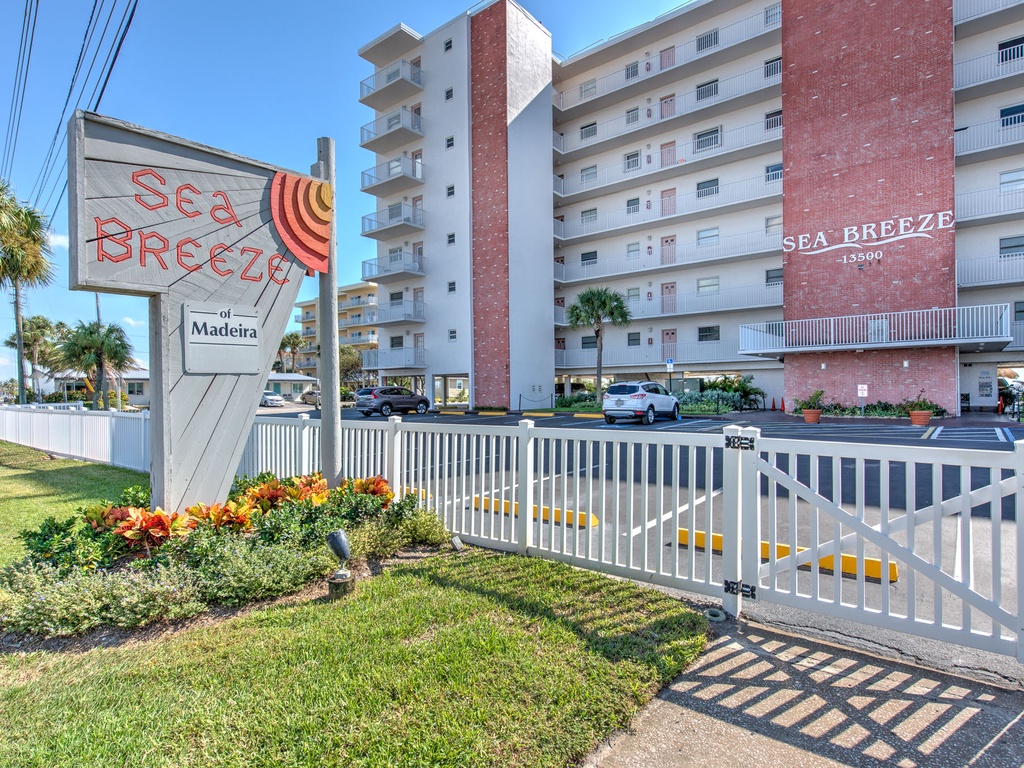 Welcome to Sea Breeze, a bright beachfront property located on Madeira Beach with convenient gated access and tropical landscaping.