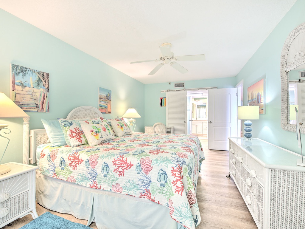 Drift off to sleep in this tranquil coastal bedroom, where sea-inspired linens and soft turquoise walls create your perfect oceanside retreat.