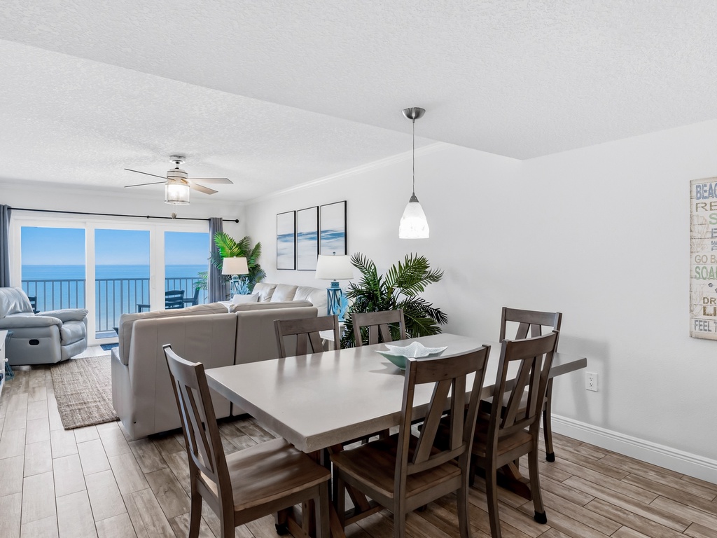 Dine with stunning ocean views through expansive windows, where beach-inspired decor creates your perfect coastal retreat.