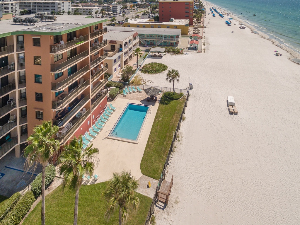 Beachfront property with pool and direct beach access on pristine sandy shores.