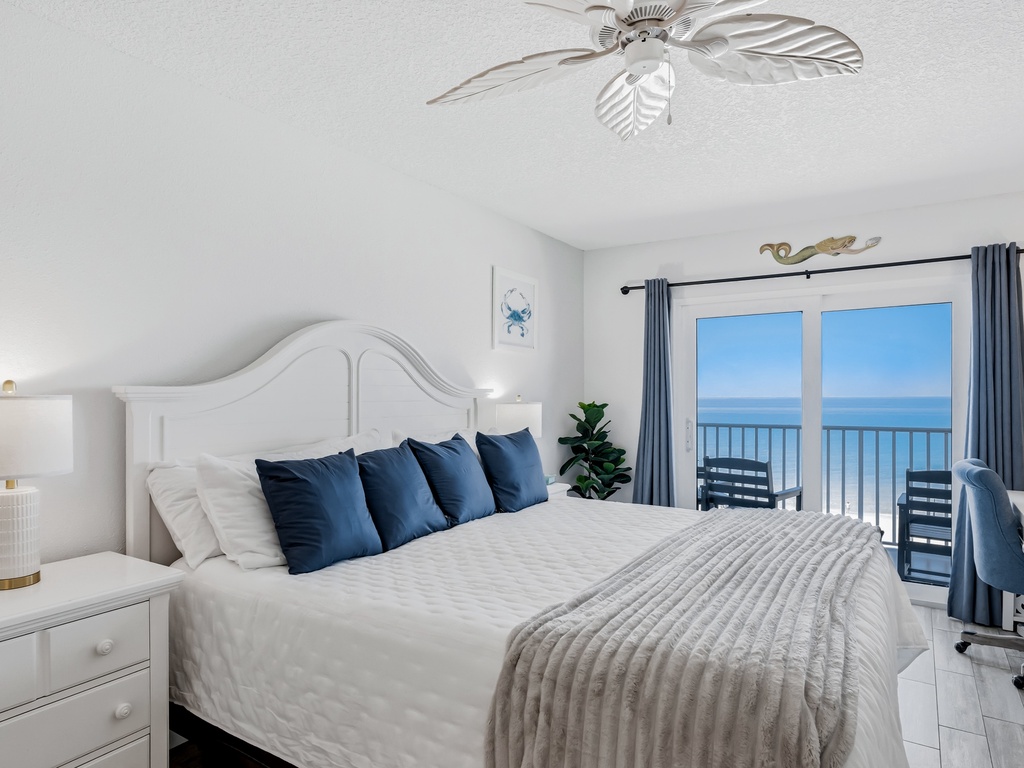 Wake up to stunning ocean views from your private balcony. The coastal-themed bedroom offers plush bedding and gentle sea breezes for perfect relaxation.