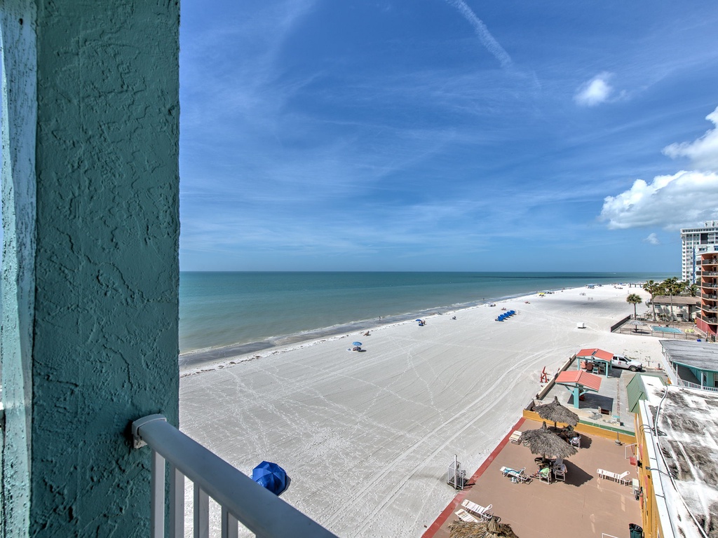 Wake up to stunning beachfront views from your private balcony, where endless white sand meets azure waters in perfect harmony.