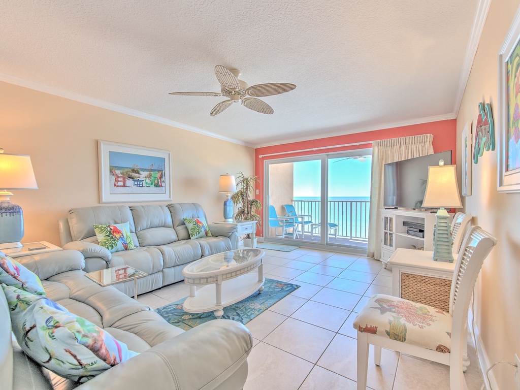Unwind in your coastal living room where tropical touches and ocean breezes create the perfect beach getaway atmosphere.