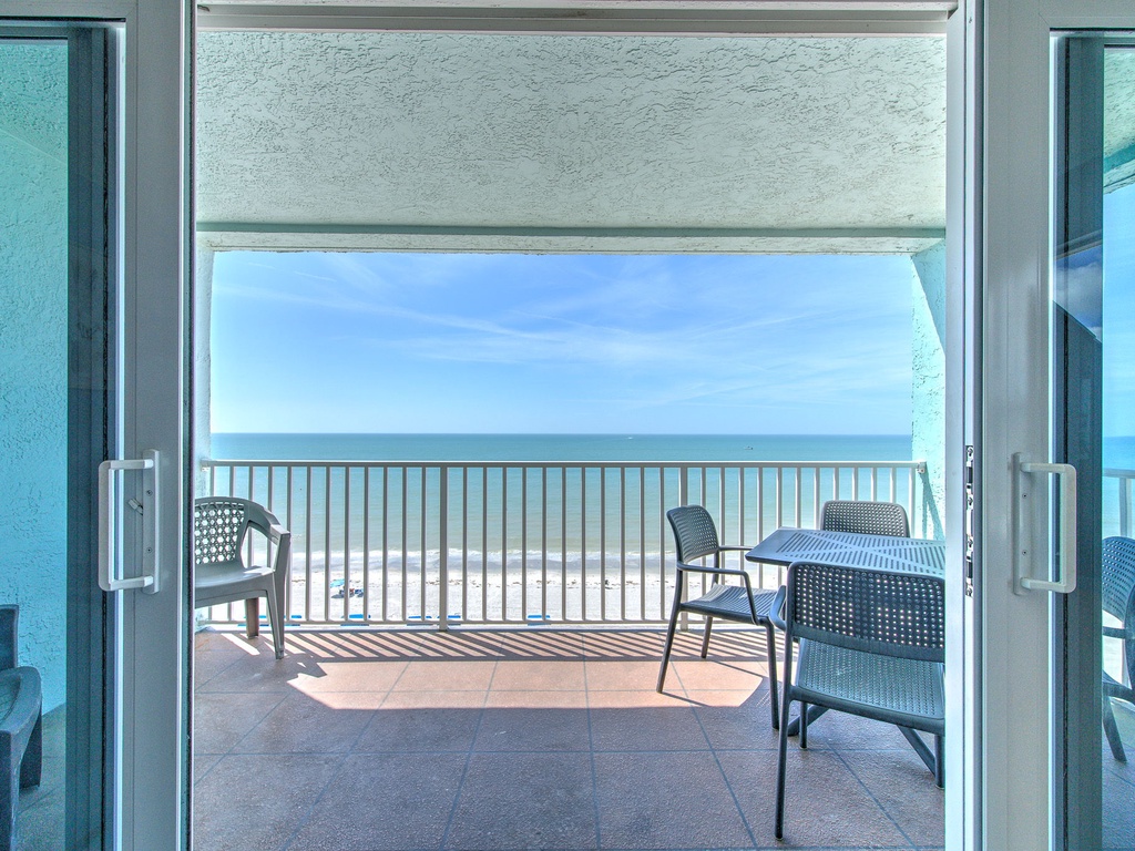 Step onto your private beachfront balcony and breathe in the salty air while enjoying unobstructed ocean views from your dining table.