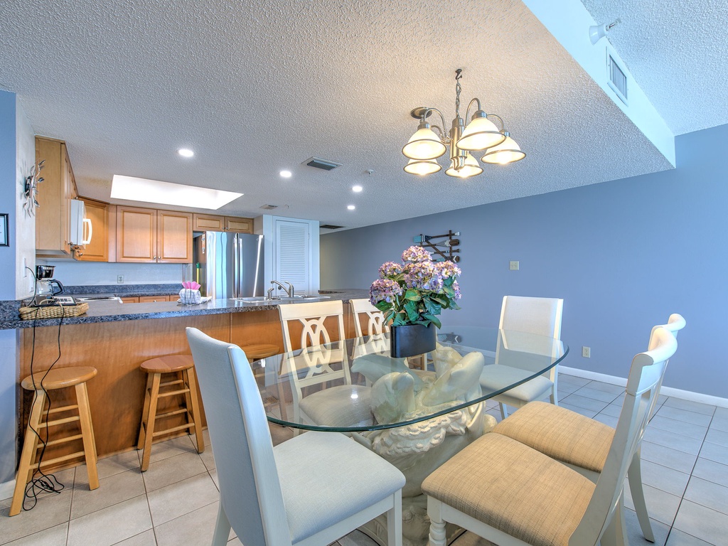 Gather around your spacious dining table for memorable meals, with the fully-equipped kitchen just steps away for easy entertaining.