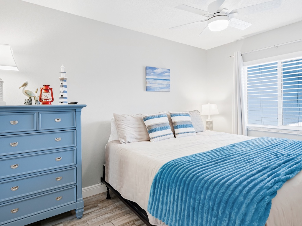 Drift off to peaceful sleep in this coastal-themed bedroom, where nautical touches and ocean blues create your perfect seaside retreat.