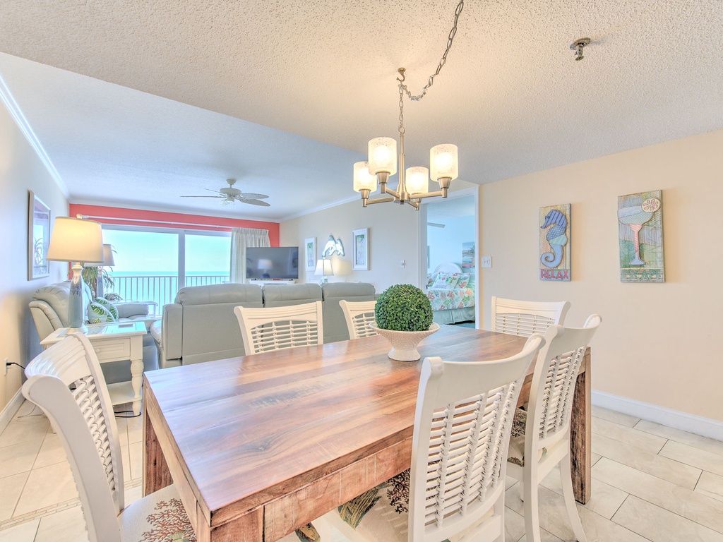 Gather around this beautiful dining table where ocean views frame every meal, creating memories in your coastal retreat.