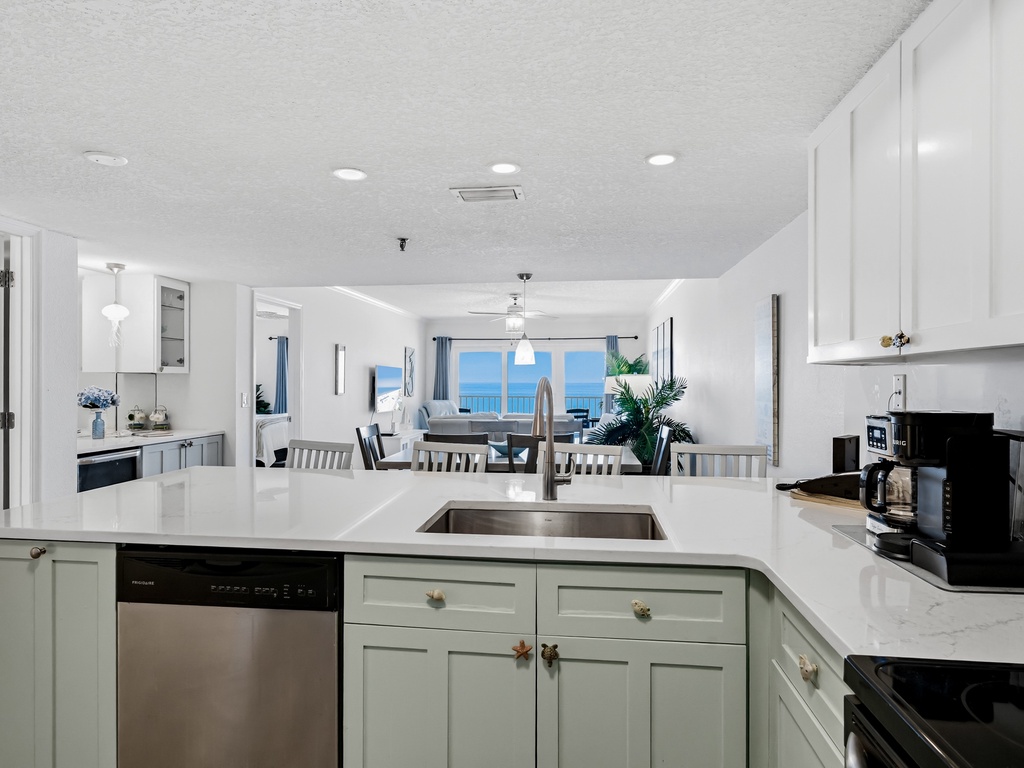 Your spacious kitchen flows seamlessly into the dining and living areas, with stunning ocean views as your backdrop while cooking.