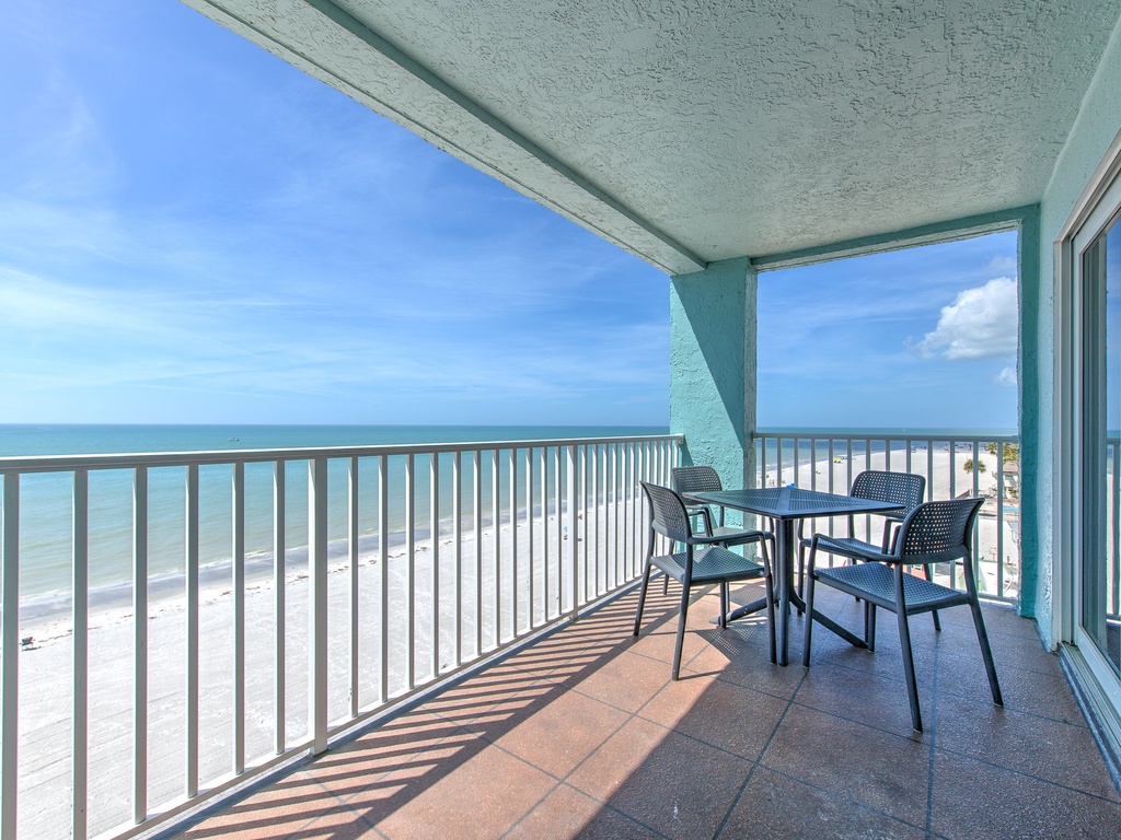 Savor your morning coffee with panoramic ocean views from this private beachfront balcony, where gentle waves and endless sky create your daily backdrop.