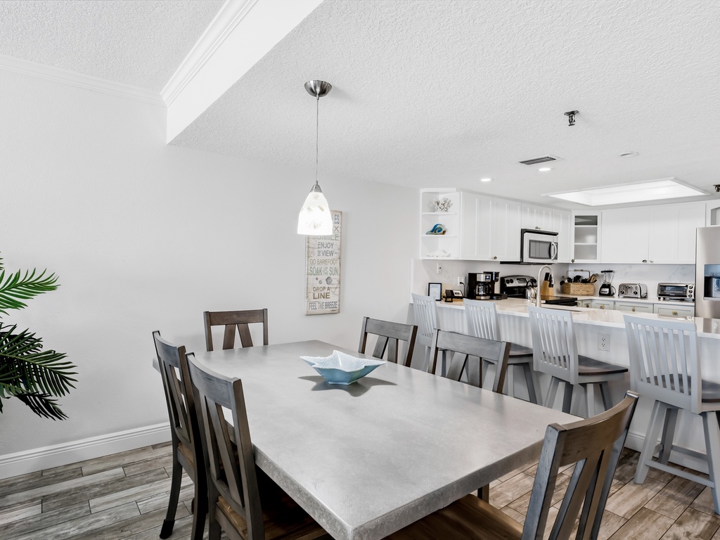 Your spacious dining area flows seamlessly into the modern kitchen, perfect for family meals and entertaining guests together.