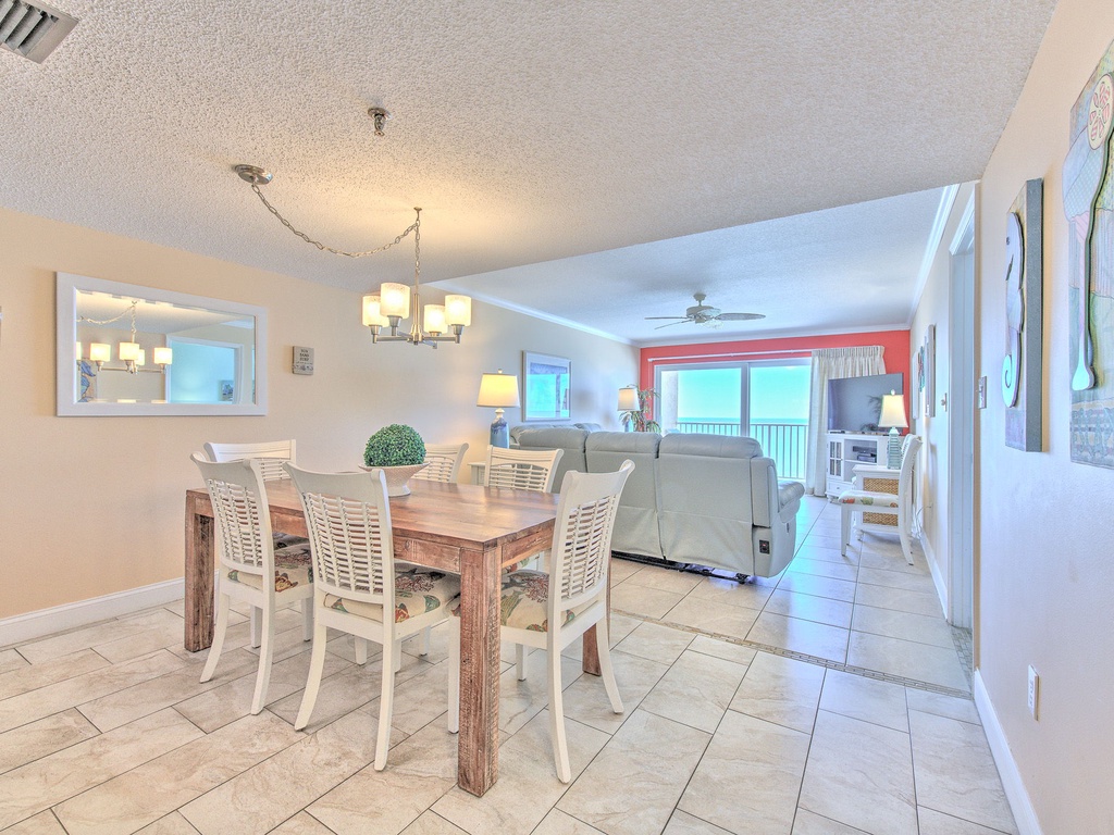 Gather around your spacious dining table where family meals become cherished memories, with the bright living area flowing seamlessly beyond.