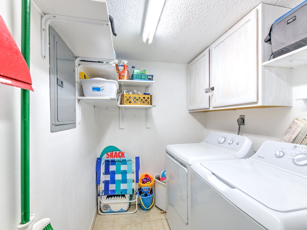 Your dedicated laundry room keeps you organized with a washer, dryer, and plenty of storage for beach gear and supplies.