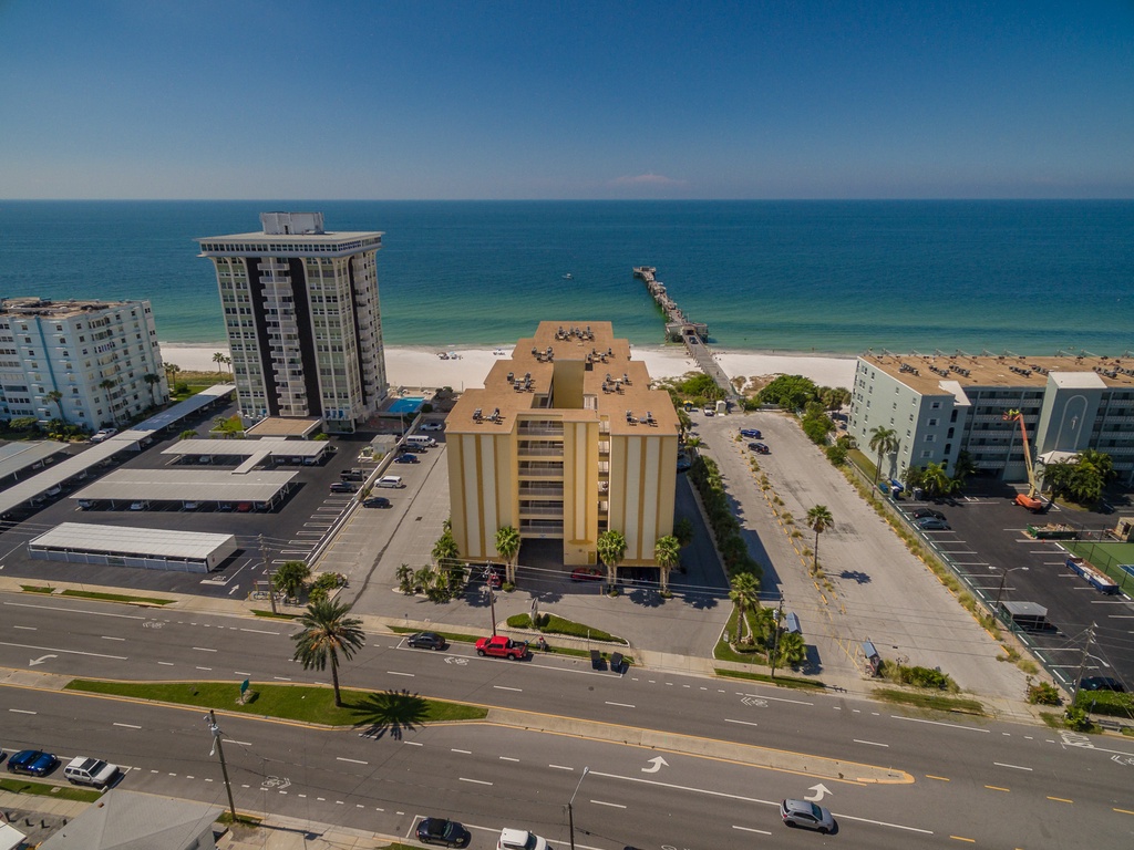 Beachfront property overlooking pristine sandy shores and turquoise waters, with convenient beach access just steps away.