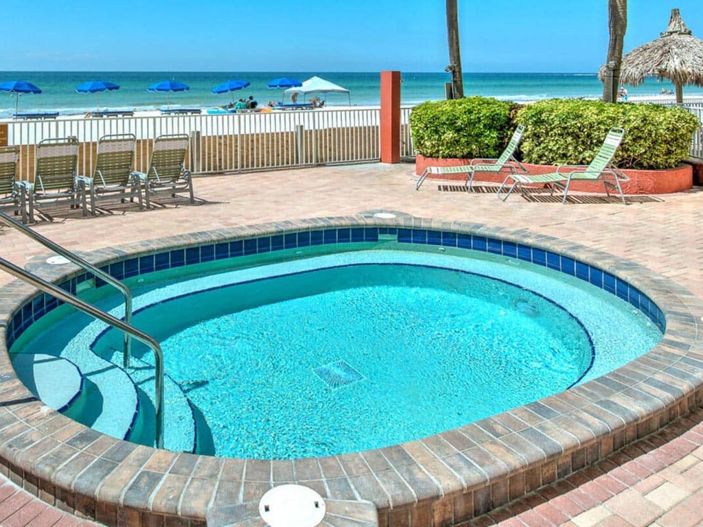 Dive into your private beachfront oasis with this sparkling pool just steps from pristine white sand and turquoise waters.