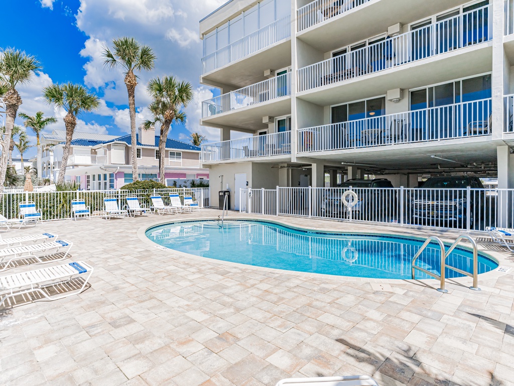 Dive into crystal-clear waters while tropical palms sway overhead. Your perfect pool day awaits with plenty of lounge chairs and Florida sunshine.