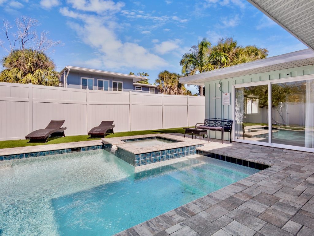 Private Pool, Spa, and Lounge with lush landscaping