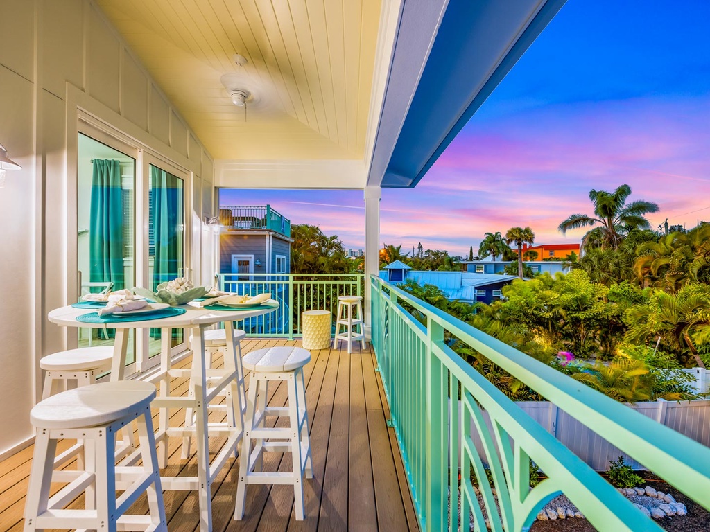 Balcony View of the Pool and Siesta Key Village at Sunset
