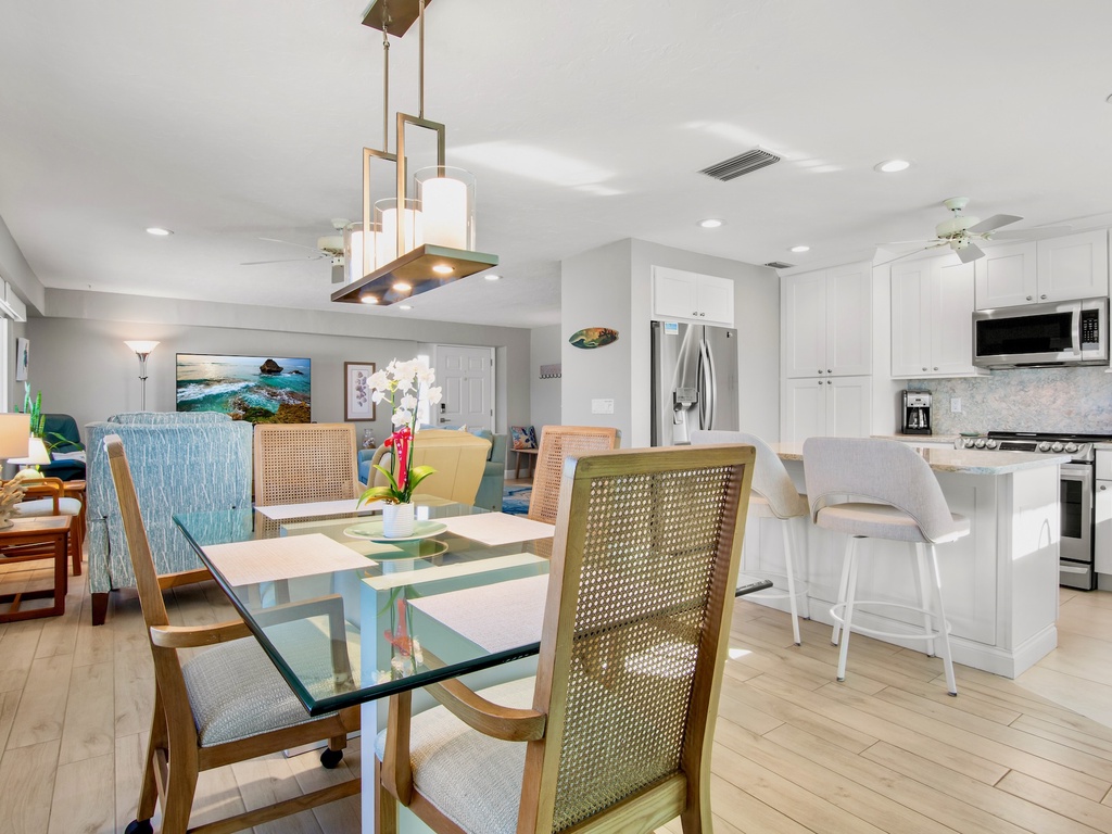 Your open-concept dining and kitchen space flows seamlessly, perfect for gathering with loved ones over home-cooked meals and morning coffee.
