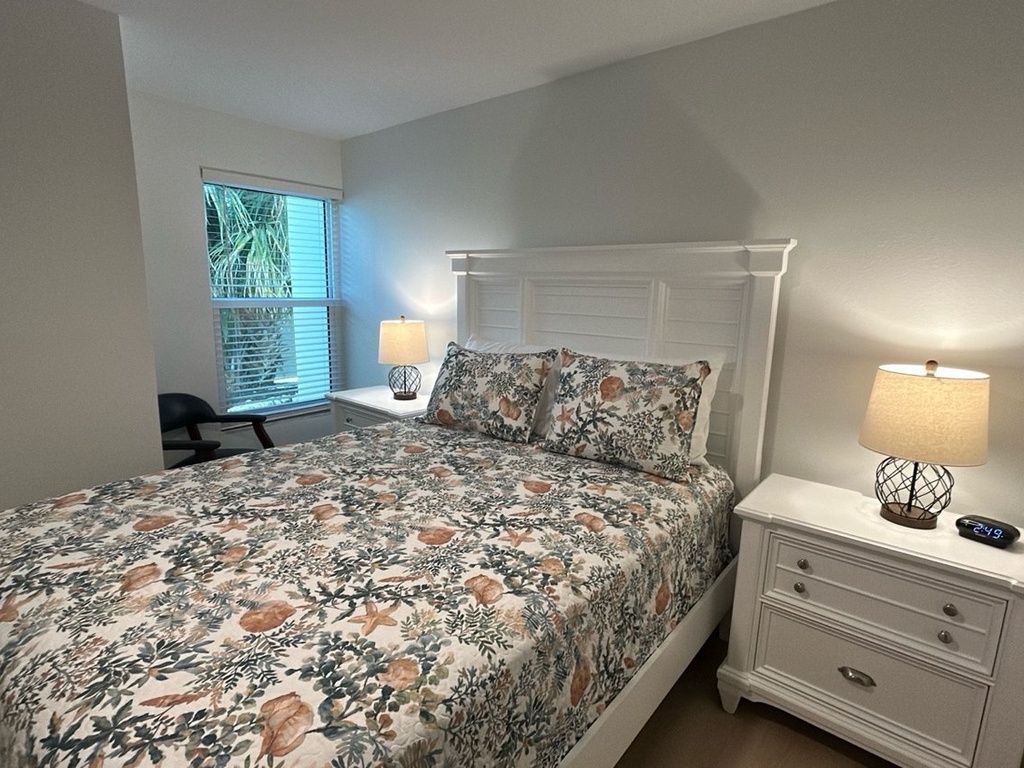 Drift off peacefully in your comfortable bedroom with soft linens, warm bedside lighting, and natural light streaming through your window.