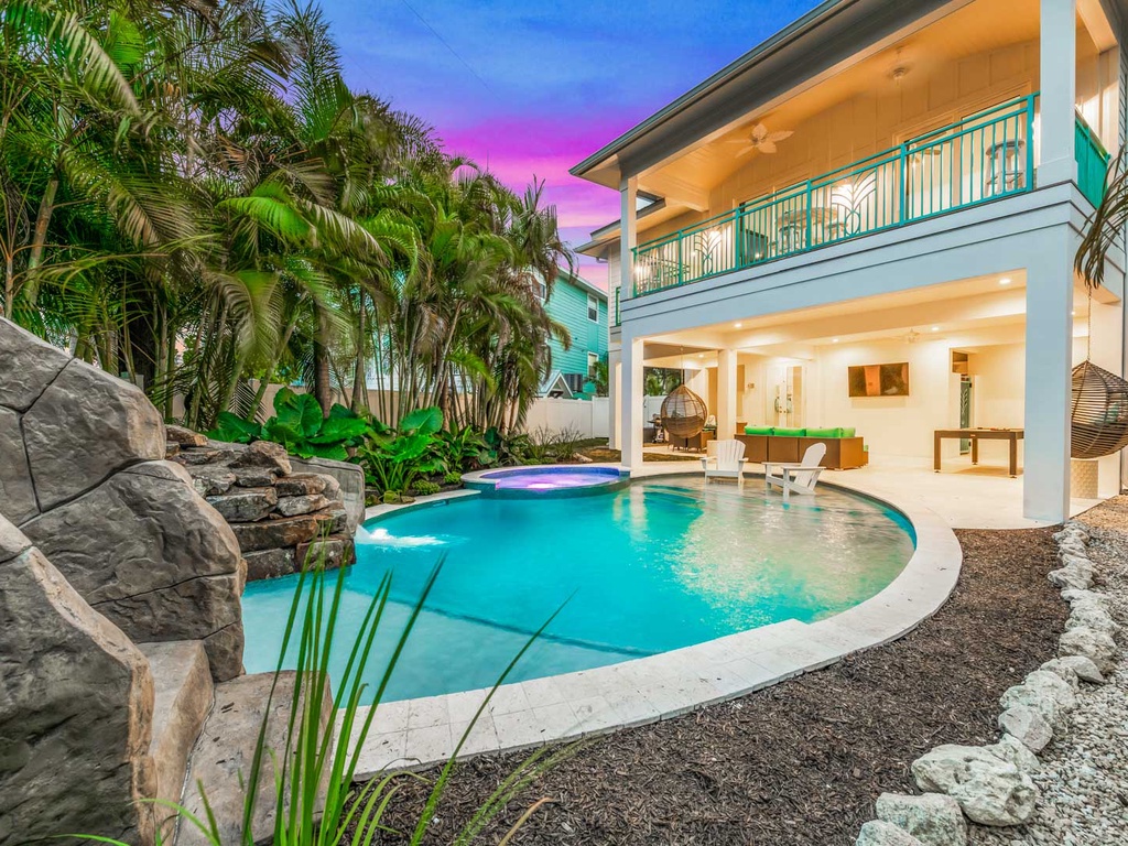 Beautiful 5 bedroom home with a pool at night