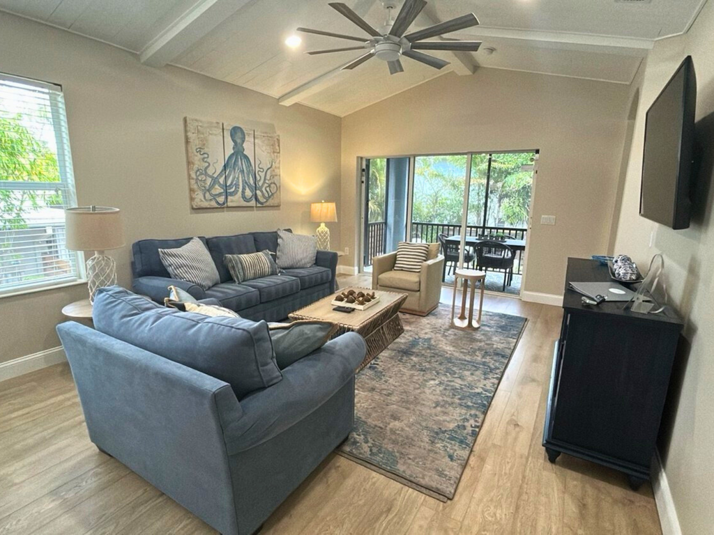 Living Room to Screened Lanai and Private Pool Area