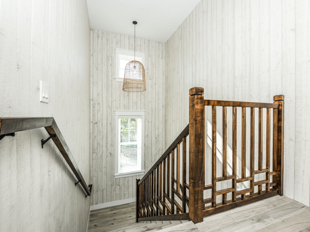 Beautiful wooden staircase leading to the 2nd floor