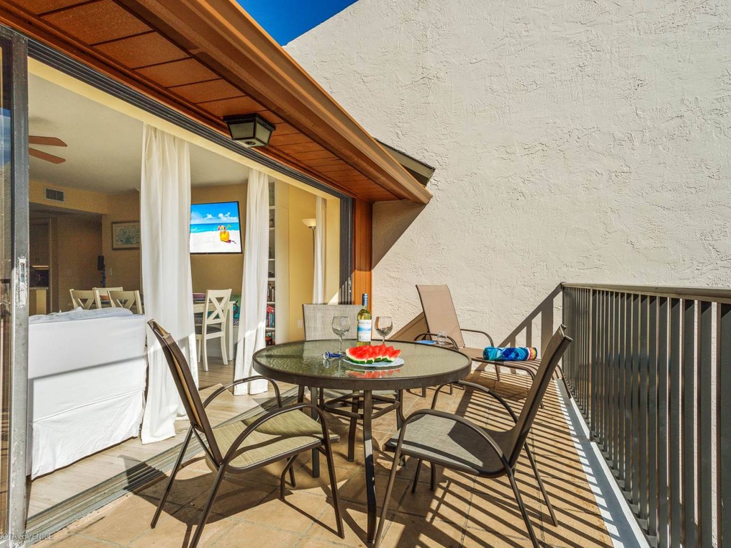 Enjoy your morning coffee on this sunny balcony with outdoor dining table, perfect for watching the world wake up.