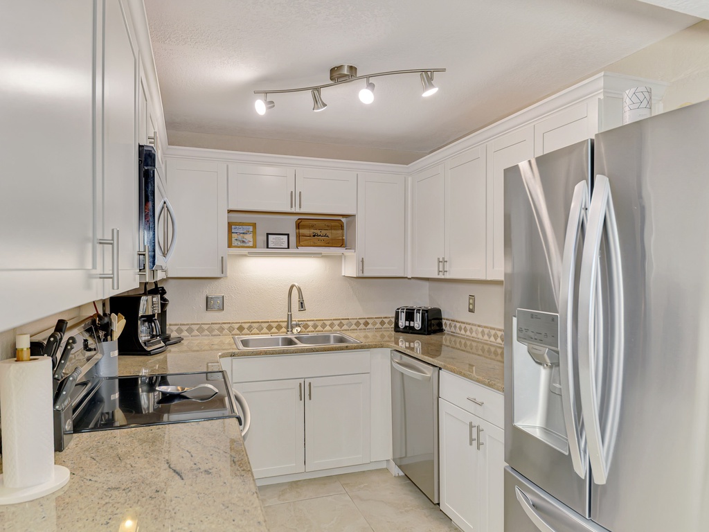 Your fully equipped kitchen features stainless steel appliances, granite countertops, and everything needed to prepare memorable meals during your stay.